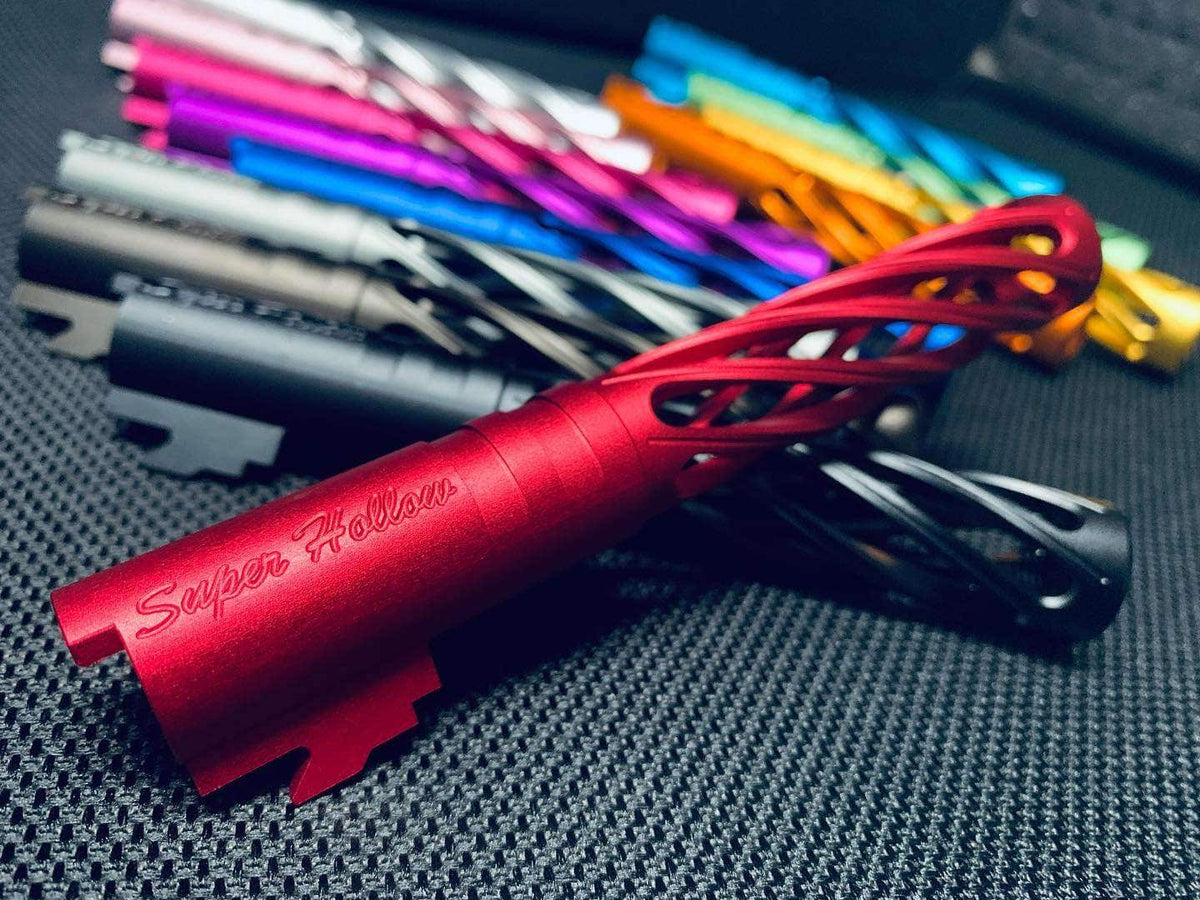 Red Dr. Black Super Hollow outer barrel engraved with Super Hollow in the foreground, with multiple colour variants including black, silver, purple, and gold fanned out behind it.