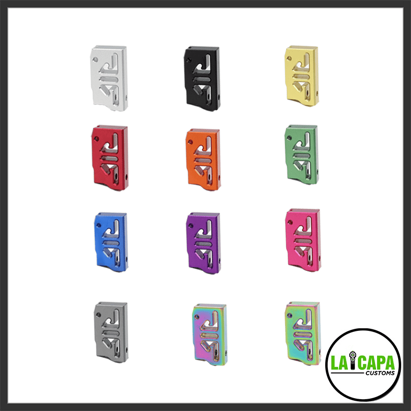 Grid of twelve CNC-cut pistol magwell funnel variants in silver, black, gold, red, orange, green, blue, purple, pink, grey, rainbow, and two-tone finishes.