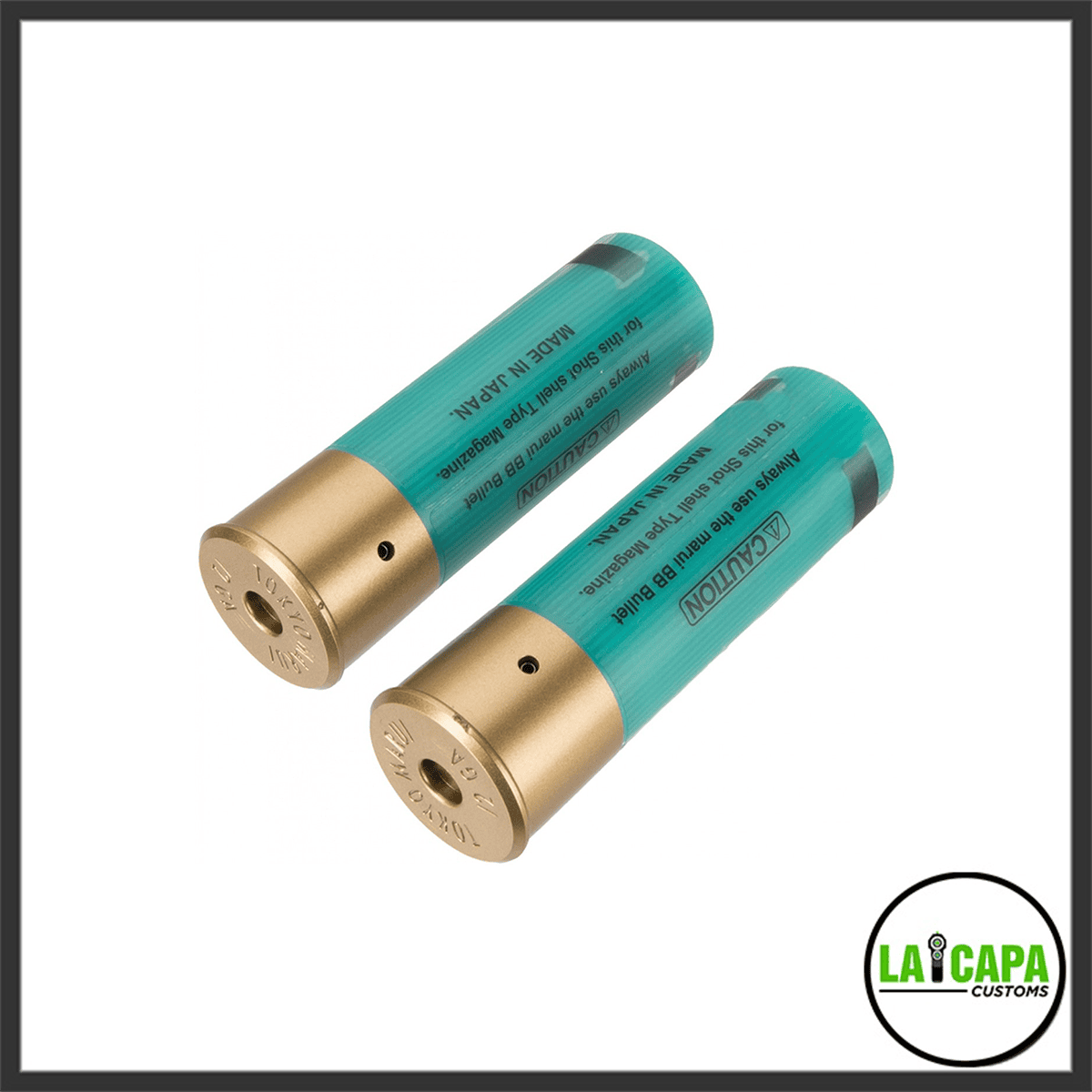 Two Tokyo Marui shotshell-type 30-round magazines in translucent green with gold-tone brass bases, showing caution text printed on the body.