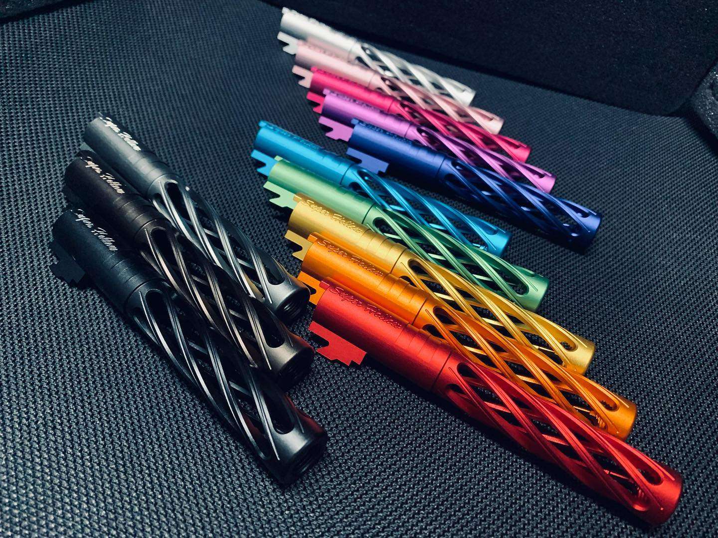 Dr. Black Super Hollow outer barrels fanned out in multiple anodised colours including black, red, orange, gold, green, teal, blue, purple, pink and silver.
