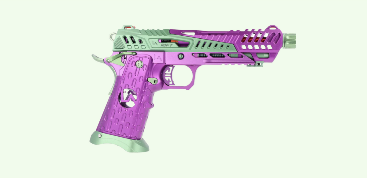 LA Capa Customs Rift Hi Capa airsoft pistol in purple and sage green anodized finish, shown from the right side against a light green background.