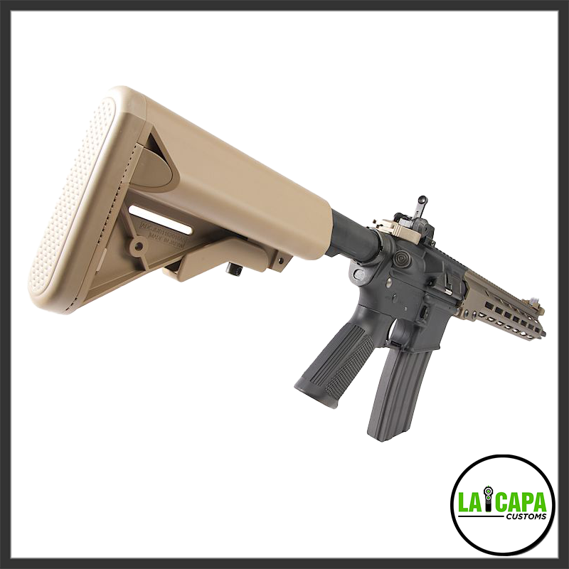 Close rear-quarter view of the Tokyo Marui x Colt URG-I SOPMOD Block 3 AEG, focusing on the flat dark earth collapsible buttstock and black lower receiver.