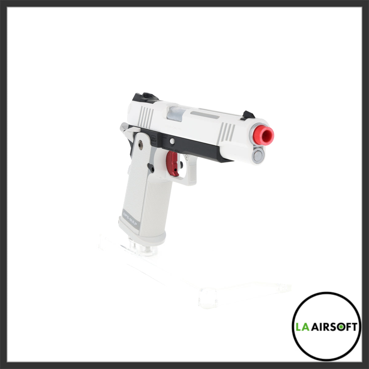 Tokyo Marui Hi Capa 5.1 D.O.R. White gas blowback pistol from the right front quarter, showing the red muzzle cap, red trigger, and OPS-M.R.P. grip markings.