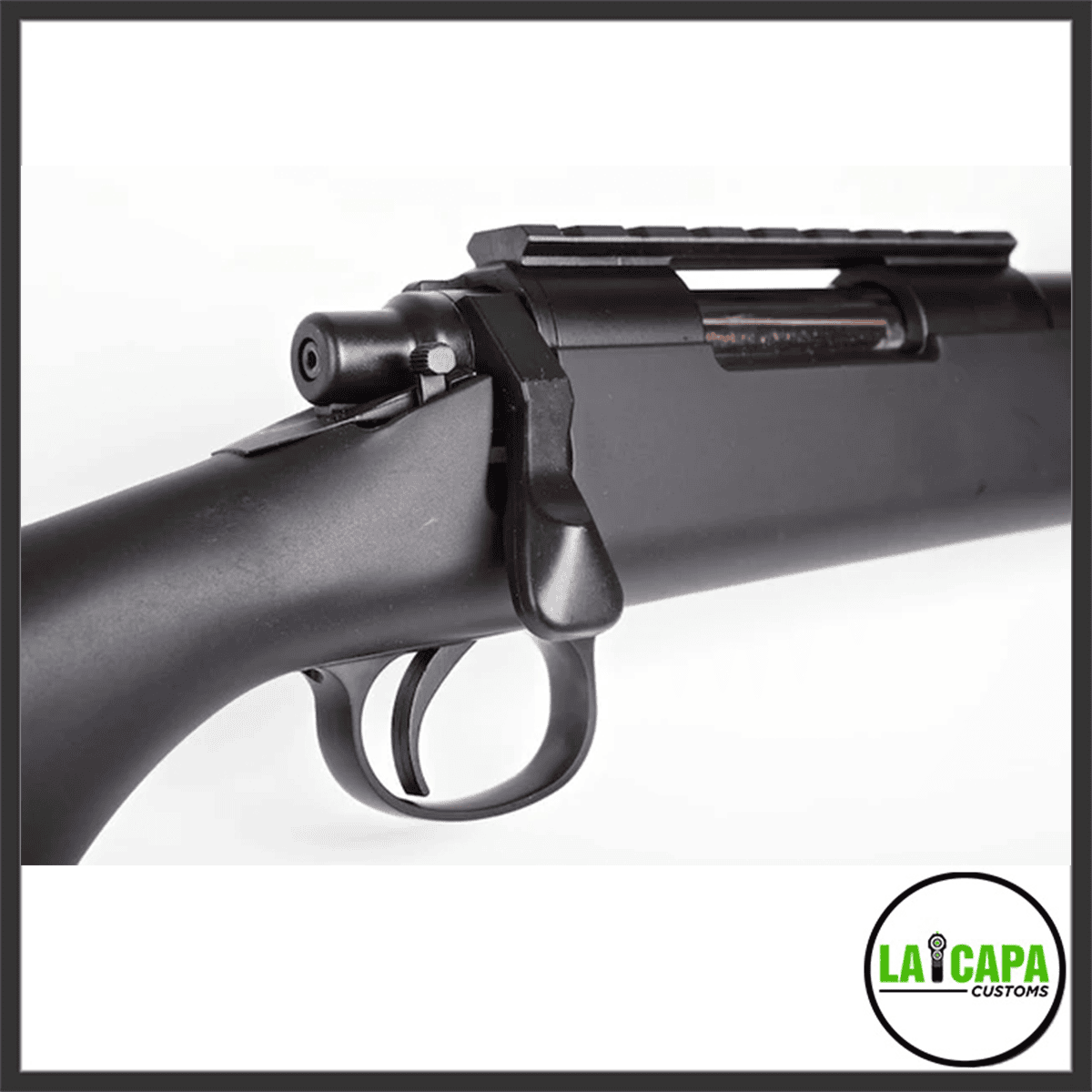 Close-up of the Tokyo Marui VSR-10 G-Spec bolt handle, trigger and Picatinny top rail from the left side.