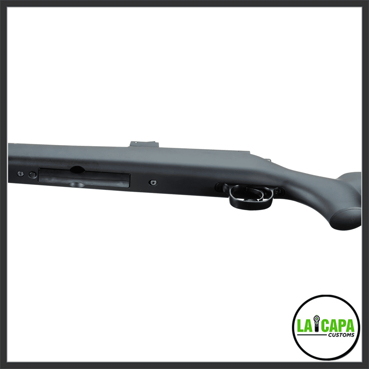 Close-up of the Tokyo Marui VSR-10 Pro action area, showing the magazine well, trigger guard, and grey synthetic stock from the right side.